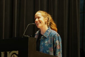Rosalie Haizlett speaking at a podium for Young Writers Day 2026
