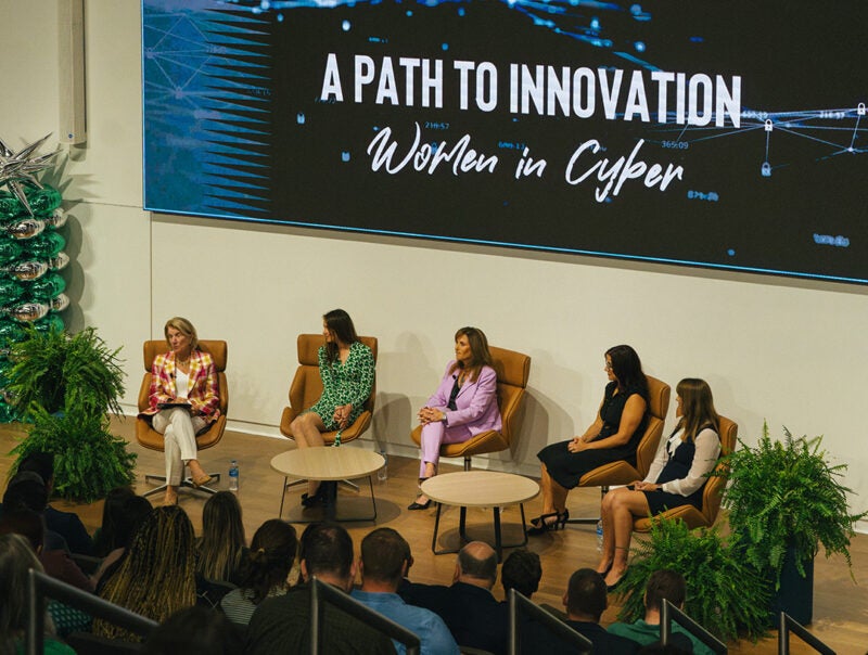 Women in Cyber panelists participate in cyber event