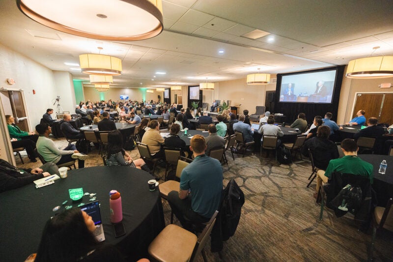 Attendees gather for a panel discussion for Marshall University's CyberCon