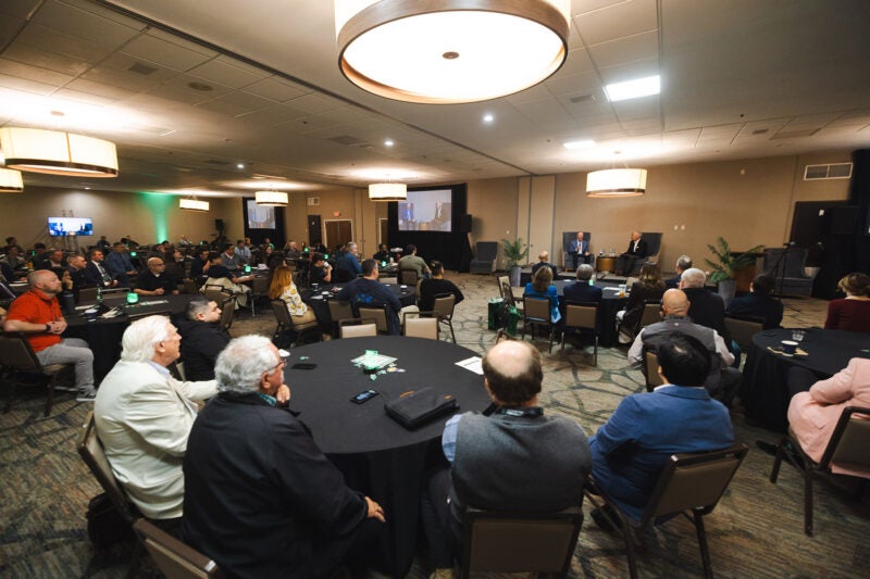Attendees gather for a panel discussion for Marshall University's CyberCon