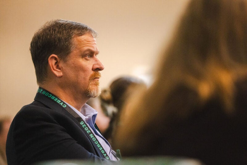 A participant listens during a CyberCon session