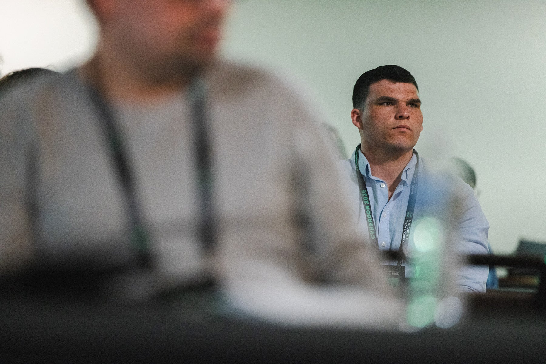 A participant listens during a CyberCon session
