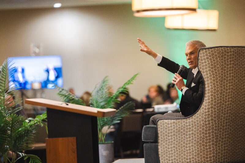 Brad D. Smith speaks during a CyberCon panel discussion