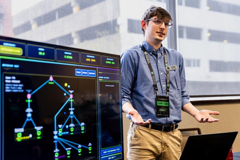 A presenter speaks during a CyberCon session