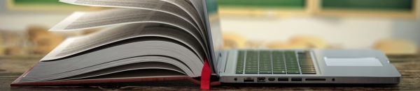 book on one side, computer on the other