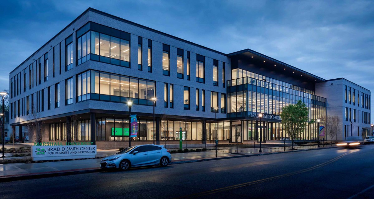 Marshall University's Brad D. Smith Center for Business and Innovation building lit up in front of a night sky