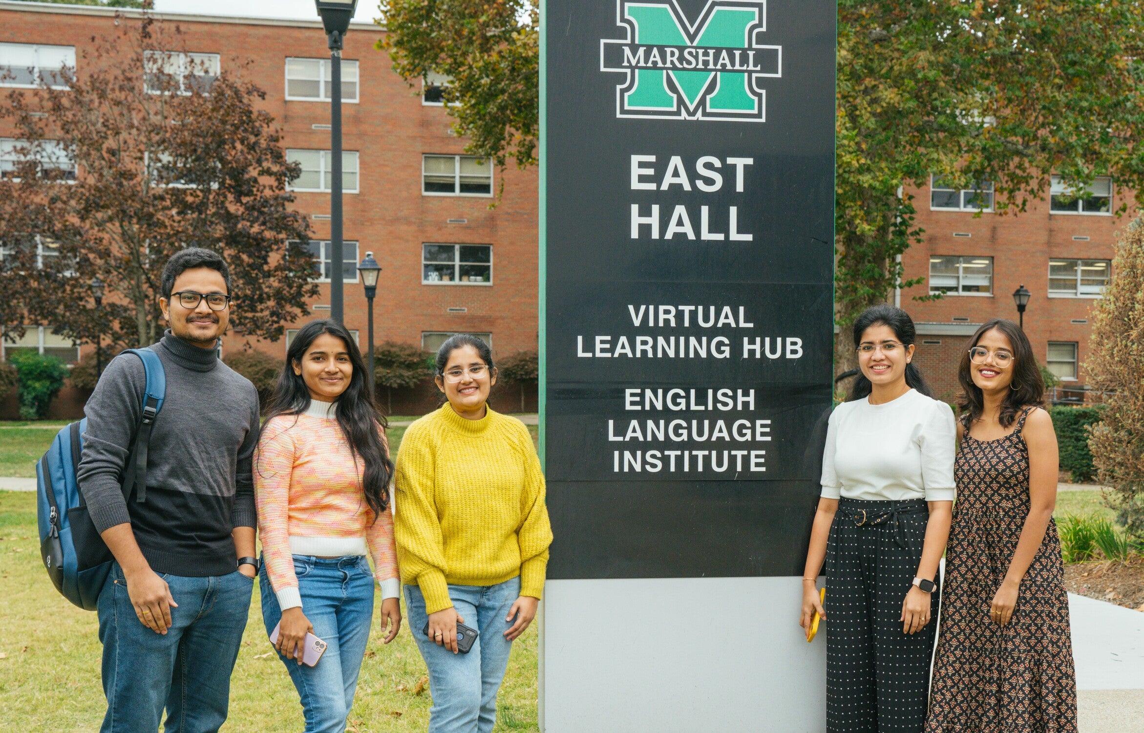 five students outside at Marshall University East Hall Virtual Learning Hub & English Learning Institute