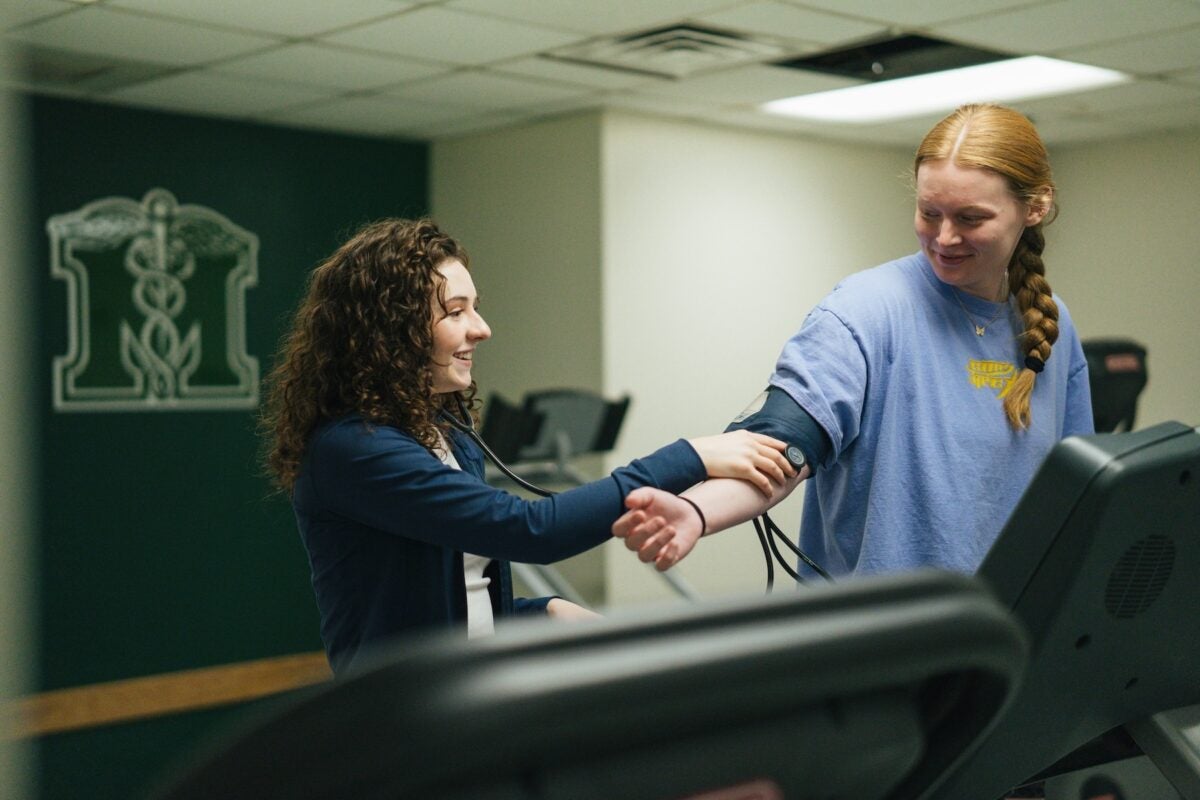 student getting blood pressure measured in an exercise science lab