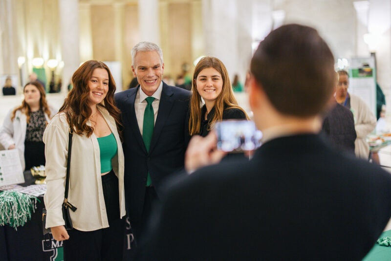 Students take a photo with Marshall President Brad D. Smith at Marshall Day at the Capitol
