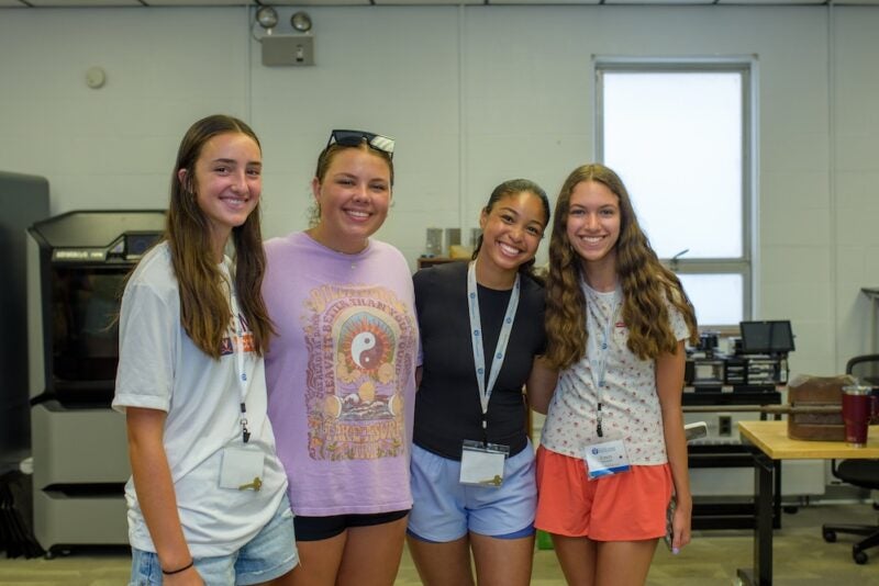 Group of 4 students posing for a photo