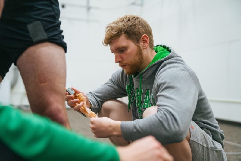 student working in the biomechanics lab on a patient's knee