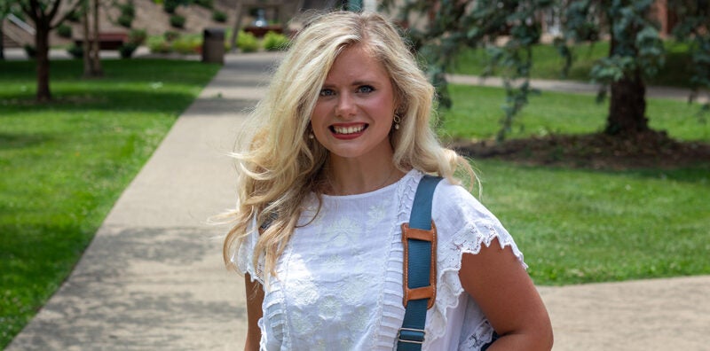 Marshall University HELP student stands on campus with a backpack ready to begin a Summer Prep session