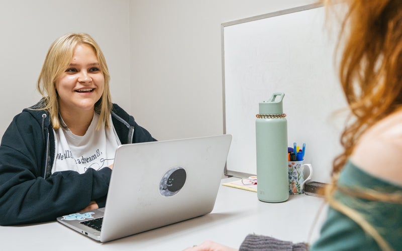 Student receiving one-on-one tutoring through Marshall University's HELP Program