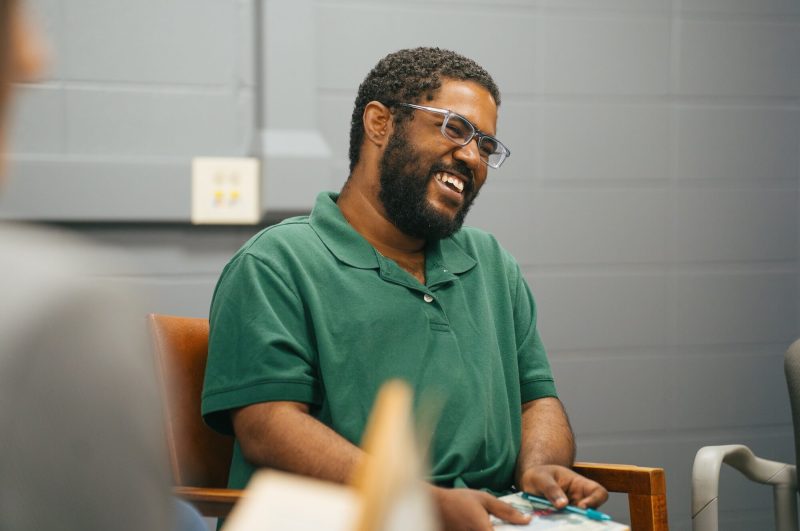 student laughing in a creative writing class