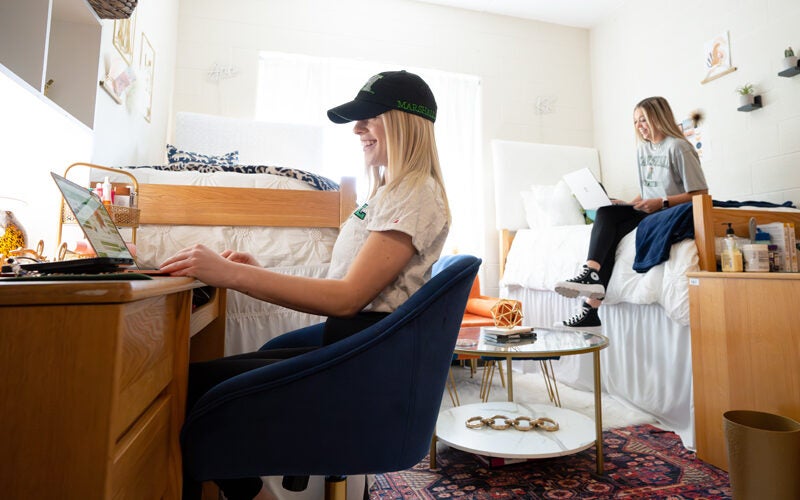 Students study in their residence hall room in Marshall Commons