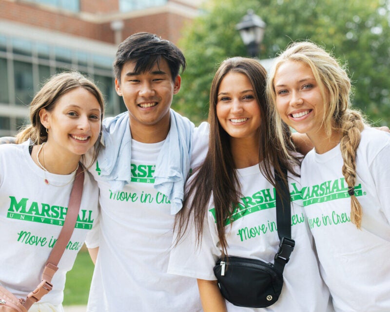 Student volunteers smile for a photo during move-in at Marshall University