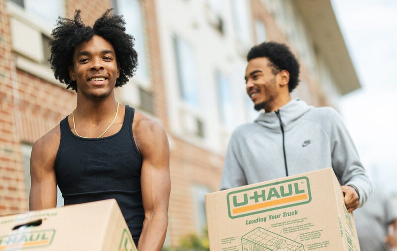 Students moving boxes into the residence halls at Marshall University
