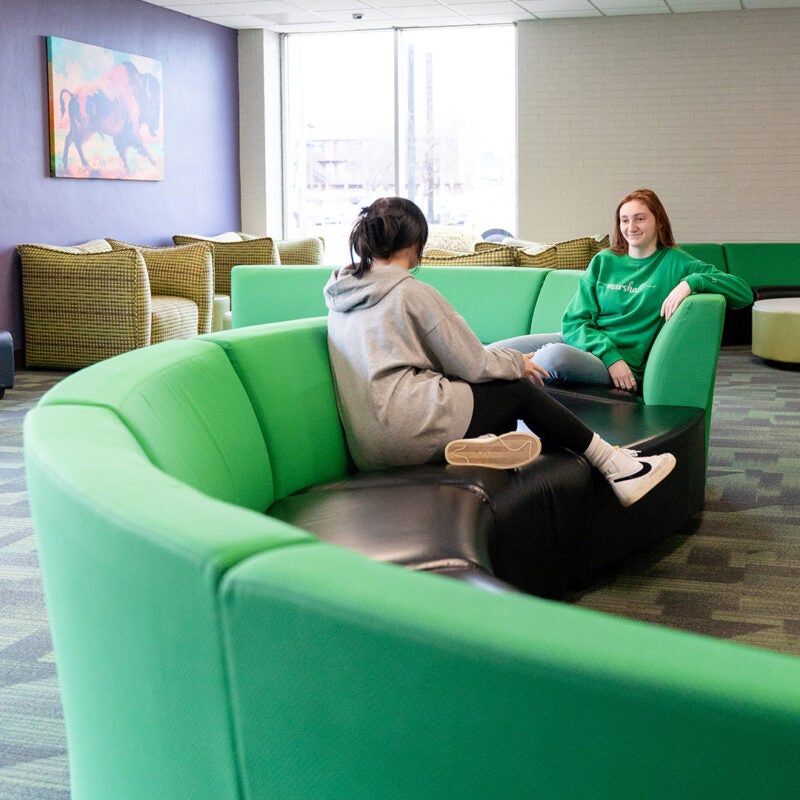Students sit in one of the lounge areas of Towers residence halls