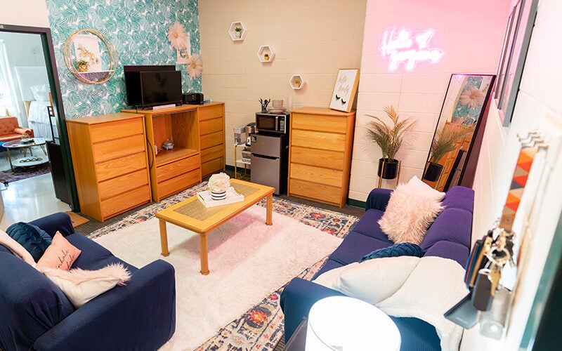 A decorated living room in a Marshall Commons suite at Marshall University
