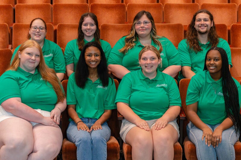 Buskirk Hall RAs gathered together for a group photo in the playhouse
