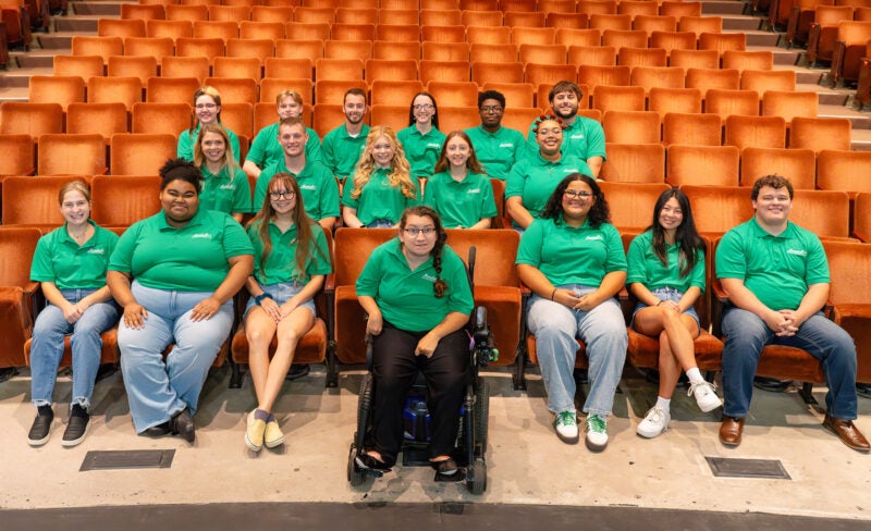 Marshall Commons RAs gathered together for a group photo in the playhouse