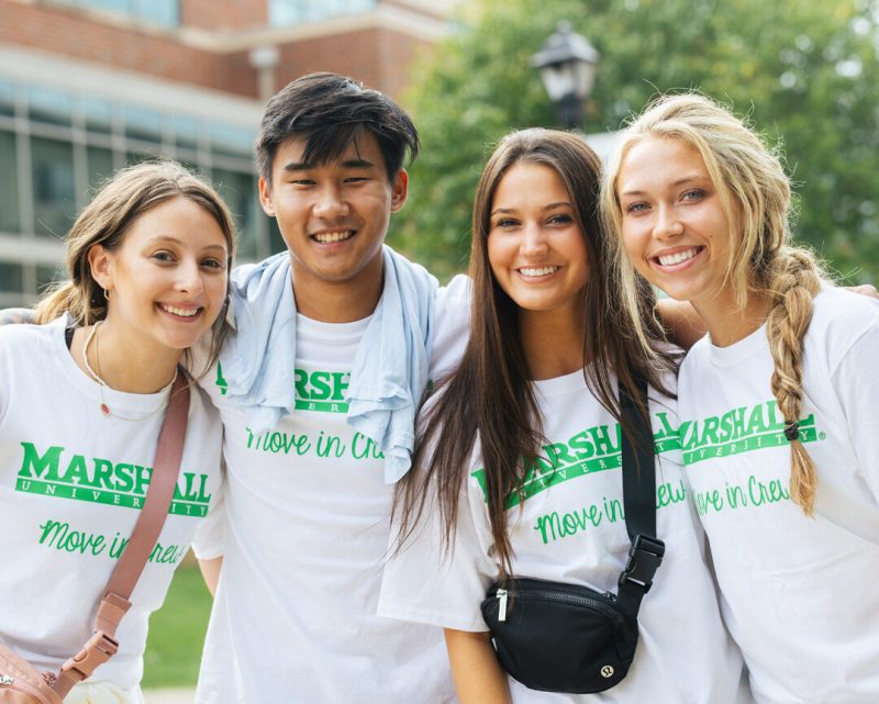 Student volunteers smile for a photo during move-in at Marshall University