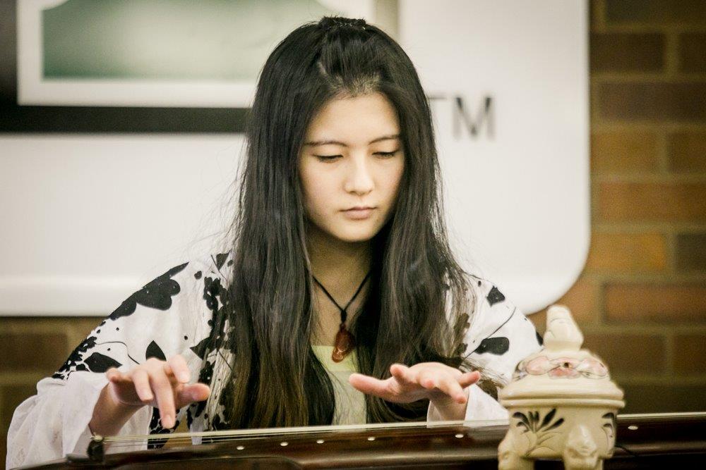 Student from China performing for the traditional New Year celebration
