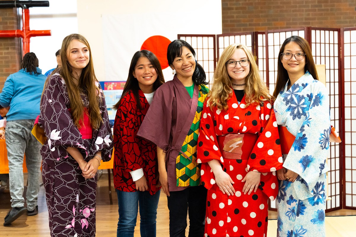 Students smile together at the International Festival