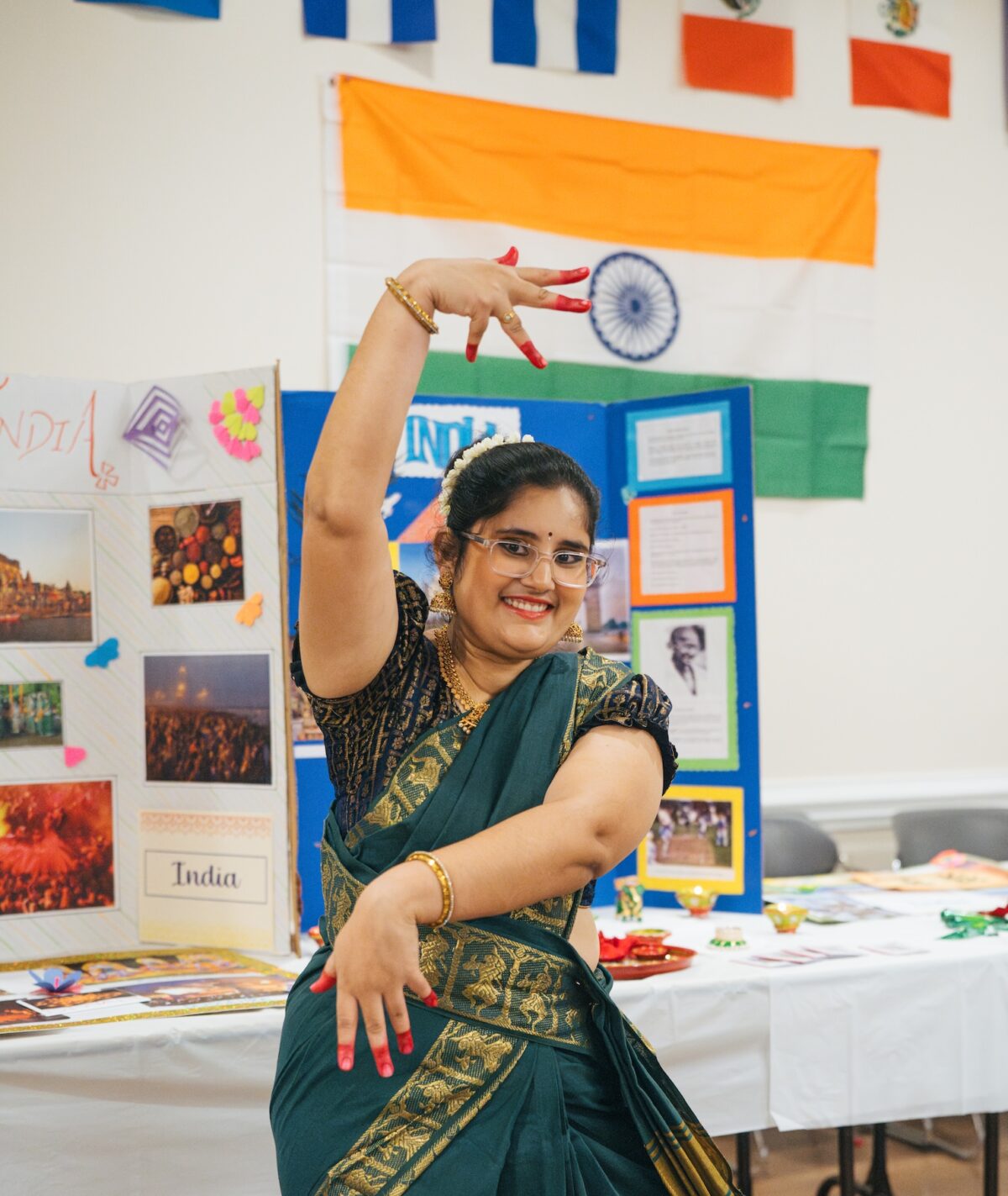 student practicing a traditional pose at the International Festival