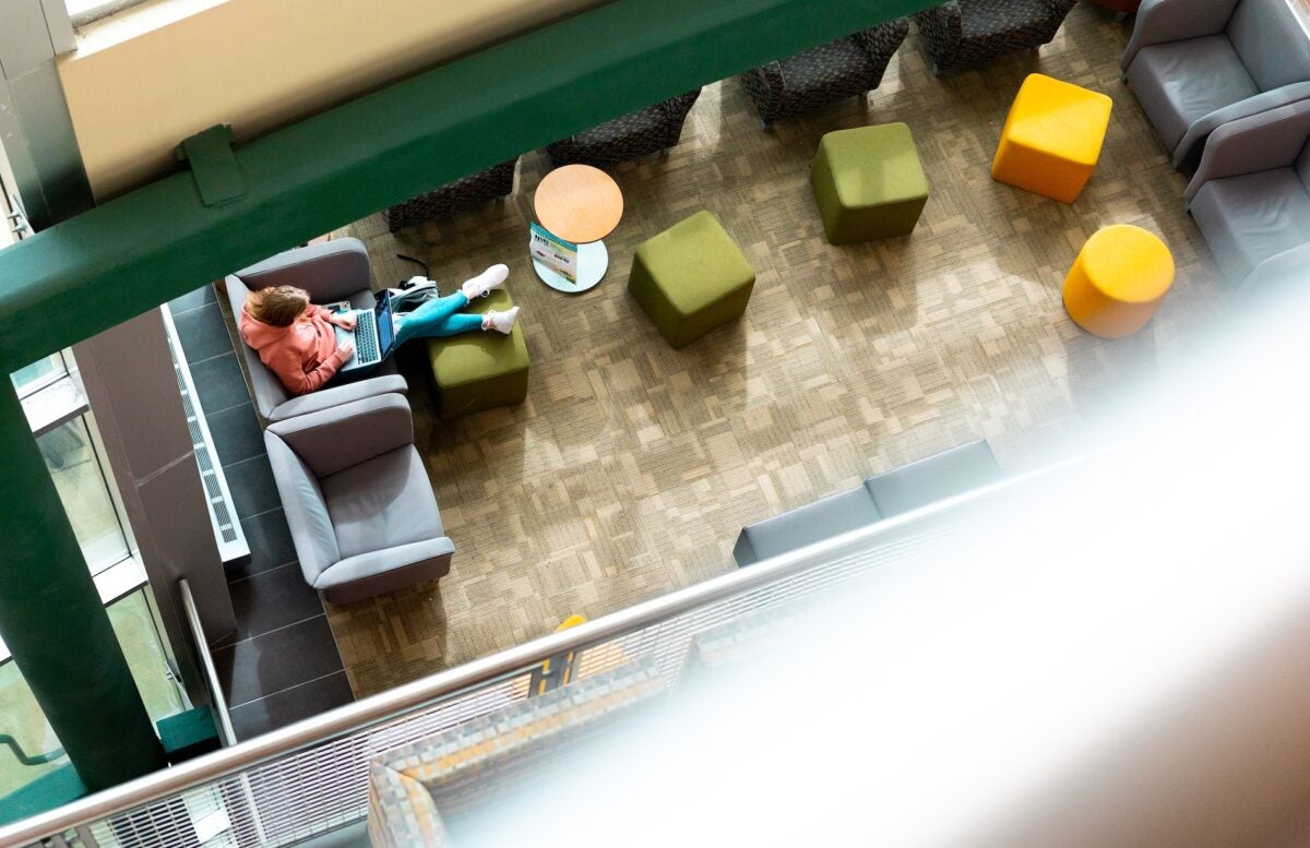 overhead shot of student studying on campus