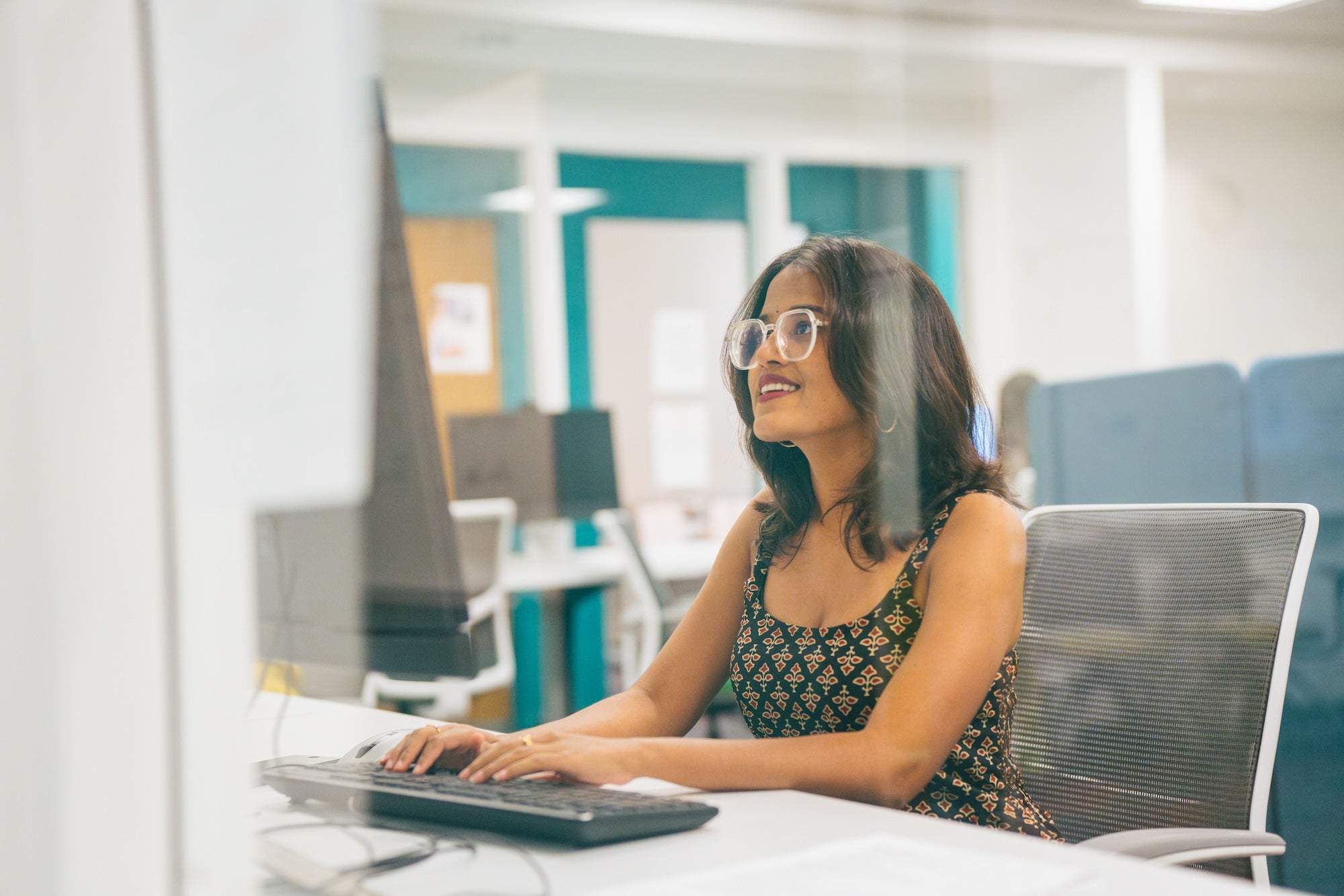 student working on a desktop computer