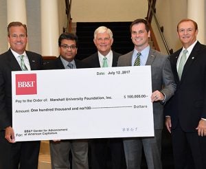 Picture of leadership center receiving a donation.