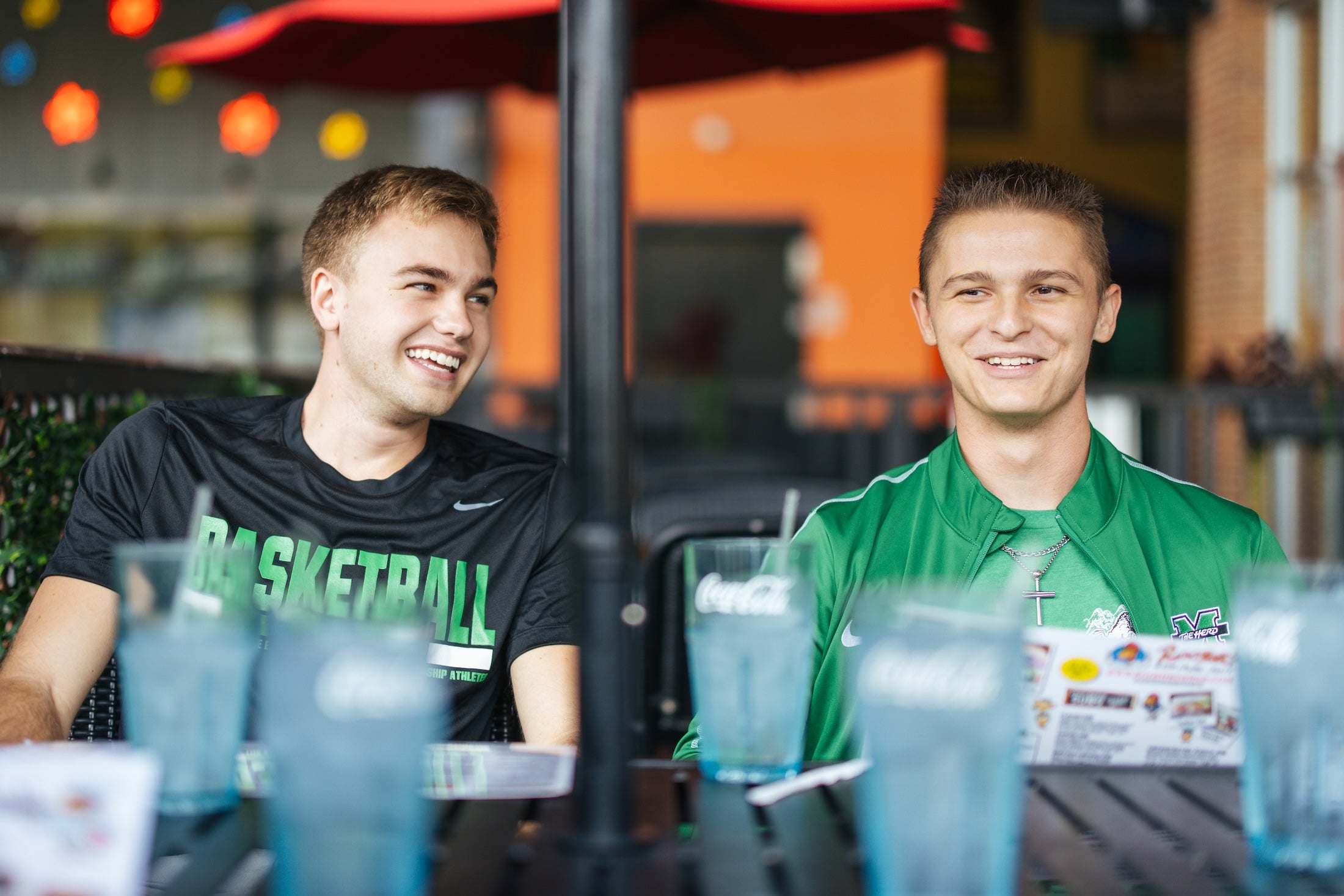 two students at a restaurant laughing