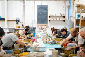 Pottery students work to create bowls for Empty Bowls 2023.