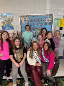 Alyssa Lilly with a classroom of students