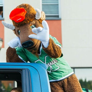 Marco participates in the Marshall University Homecoming Parade