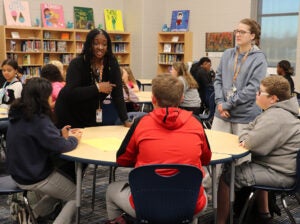 Cassie Owens Moore is pictured talking with students at Seneca Middle School in Seneca, South Carolina.