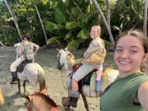 Maggie Dickerson takes a selfie while horseback riding on the Beach in Costa Rica