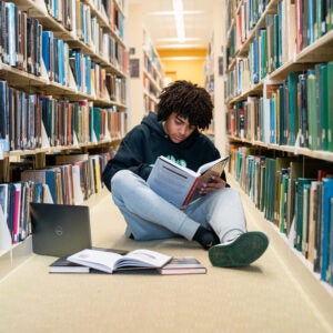 Tristan Hornbuckle studies in Marshall University's Drinko Library while take dual enrollment courses through the Herd Academy