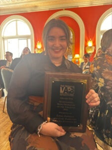 Emma Johnson holds an award during the attending the Virginias Associated Press Broadcasters Awards Ceremony.