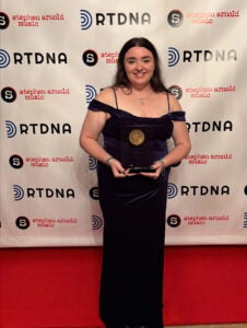 Emma Johnson smiles with her award at the Edward R. Murrow Awards Gala in New York City