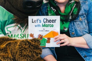 A close up of the cover of Let's Cheer with Marco