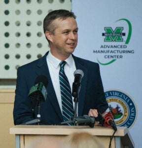 Brandon Dennison speaks at a partnership announcement for Marshall University’s Advanced Manufacturing Center
