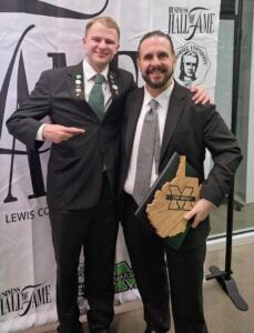 Jamison and Glenn wear suits and smile together at the 2026 LCOB Hall of Fame ceremony