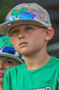 Kenyon as a child at a Herd game.
