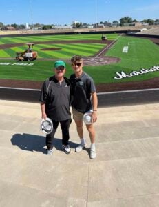 Image of May and Collins at the stadium as it was being built. 