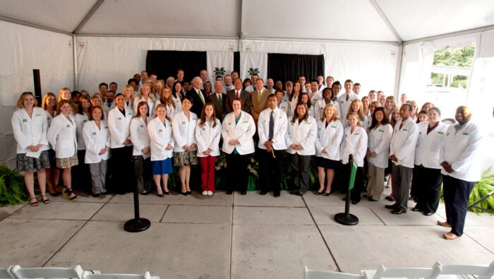 Marshall University School of Pharmacy's inaugural class and university and state officials gather for a photo at the school's ribbon-cutting in August 2012.
