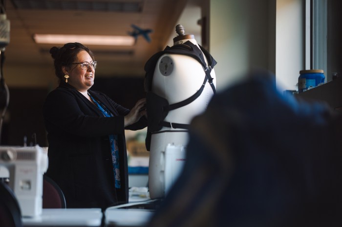 Olivia Trees works on creating a custom costume for Marshall University's Marco