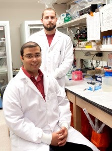 Marshall University Joan C. Edwards School of Medicine biomedical sciences Ph.D. students Johannes Fahrmann, standing, and Rounak Nande