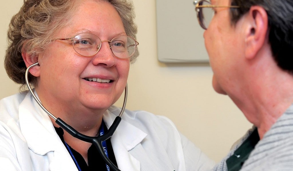 Photo of Dr. Shirley Neitch with patient